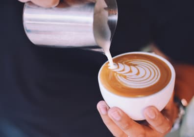Barista makes coffee art